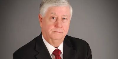 ROBERT L. GREER